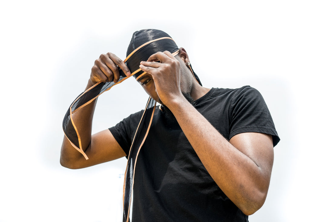 Man tying a silky durag for 360 waves after brushing session