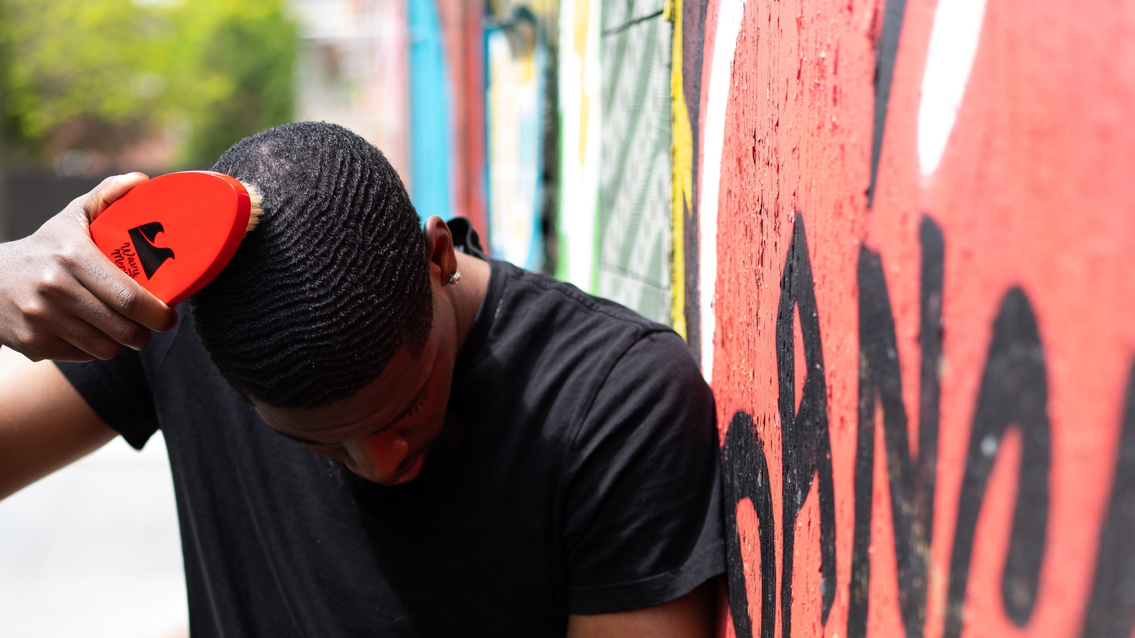 a brush placed on 360 waves hairstyle