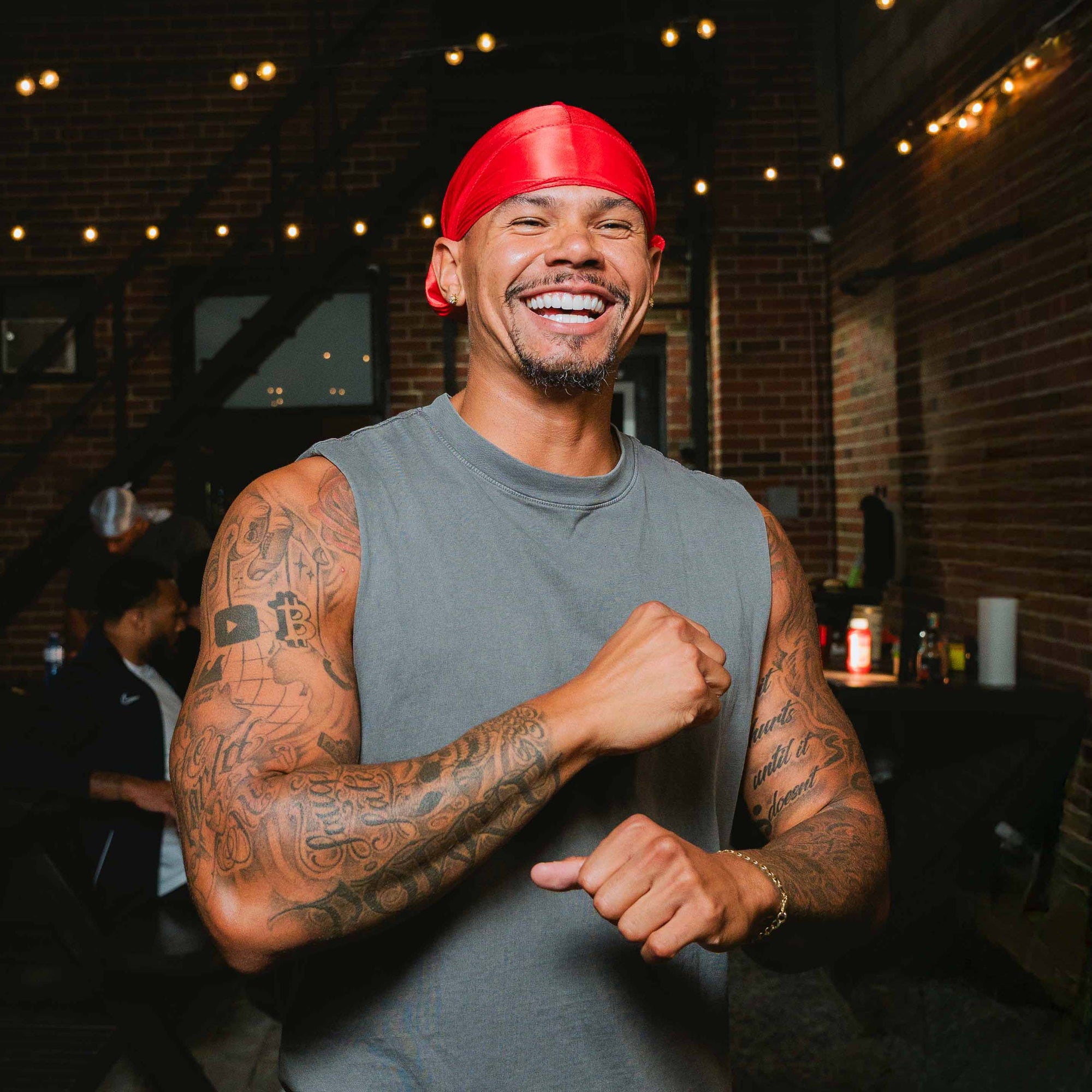 Model smiling wearing a silky durag