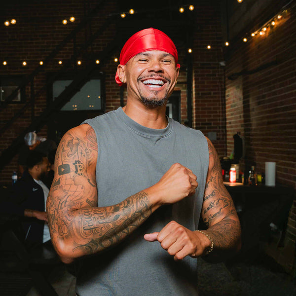 Model smiling wearing a silky durag