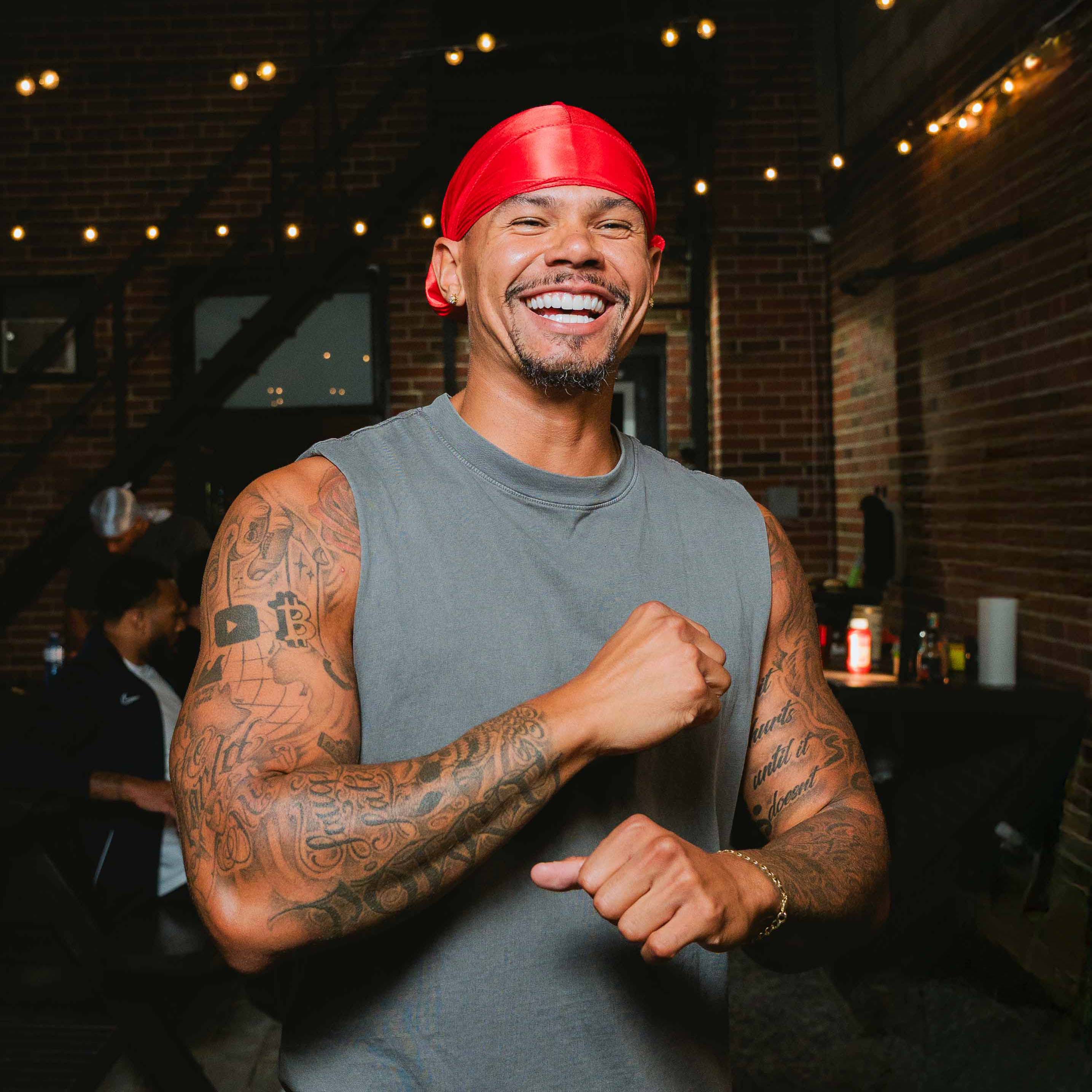 Model smiling wearing a silky durag