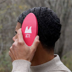 person holding a hard wave brush against their 360 waves